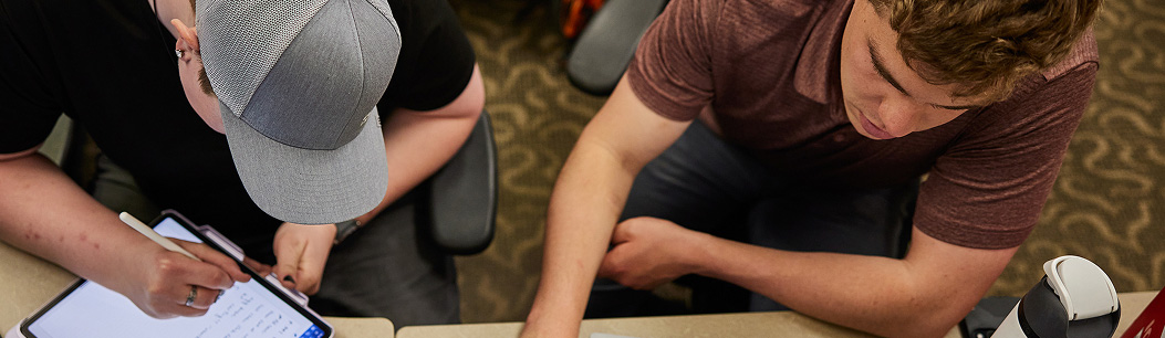 Two people working together
