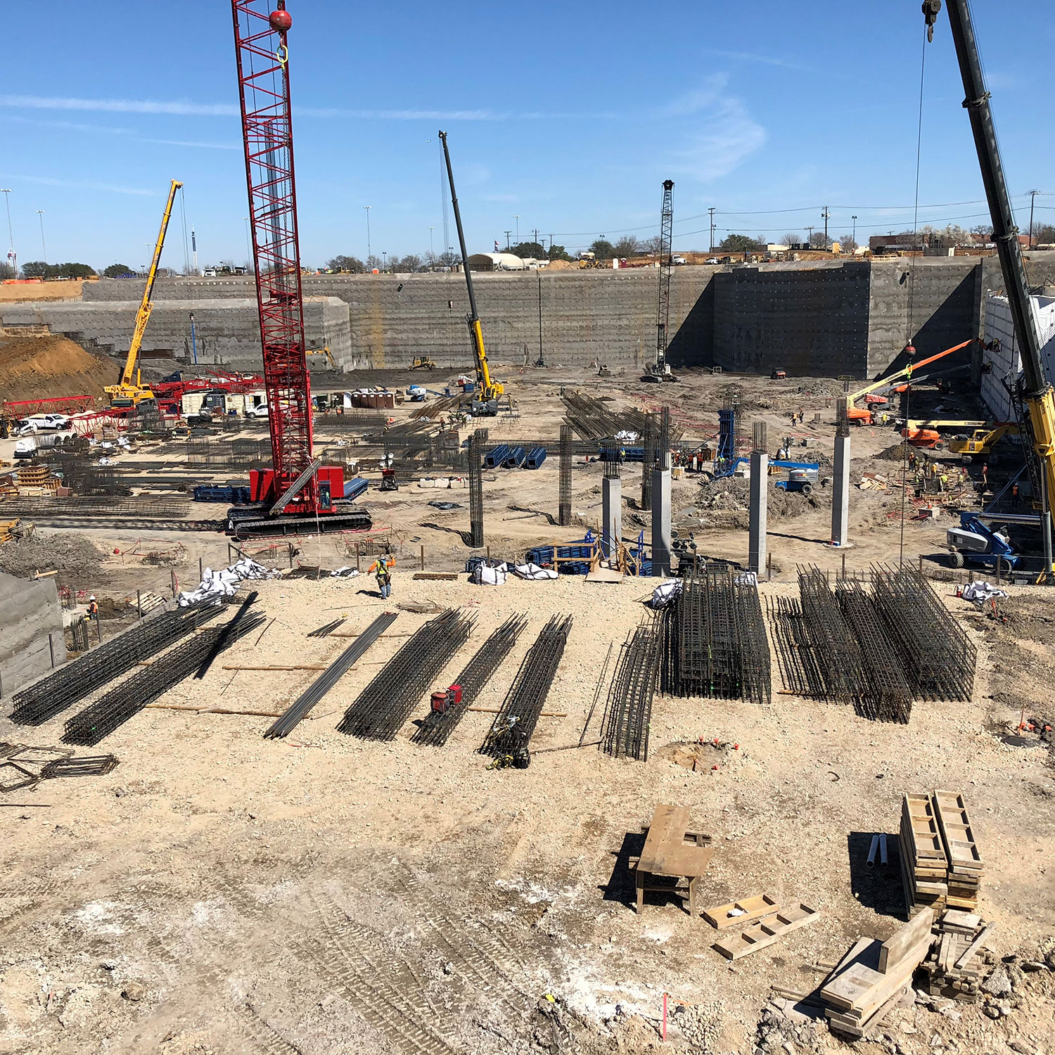 Work site with cranes and construction materials