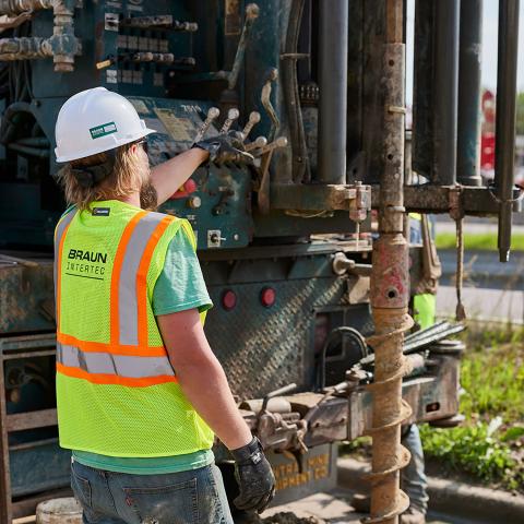 Person using a drill rig