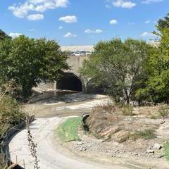 A culvert with water flowing through it 