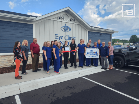 People in scrubs outside of a dentist office