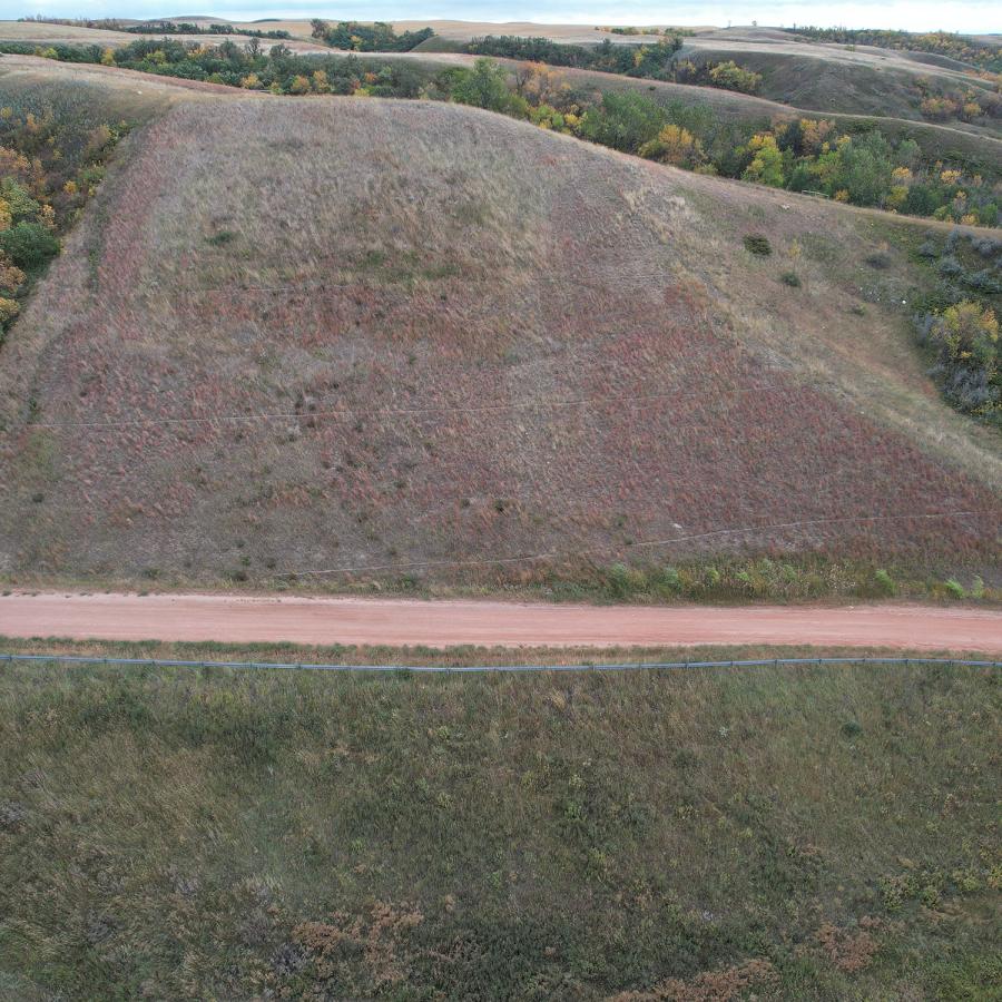 Aerial photo of a road on a sloping hill