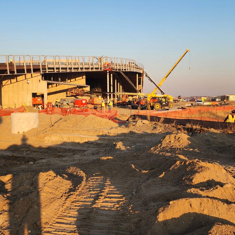 Construction site of a building with a crane nearby